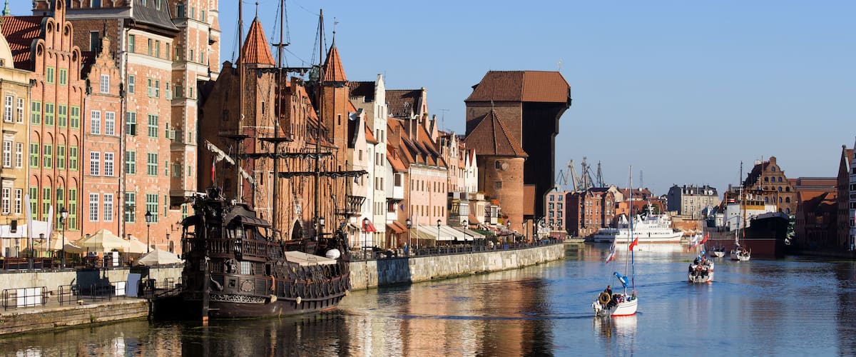 Picturesque scenery in the Old Town of Gdansk (Danzig) in Poland with Motlava river and the Crane on the far end