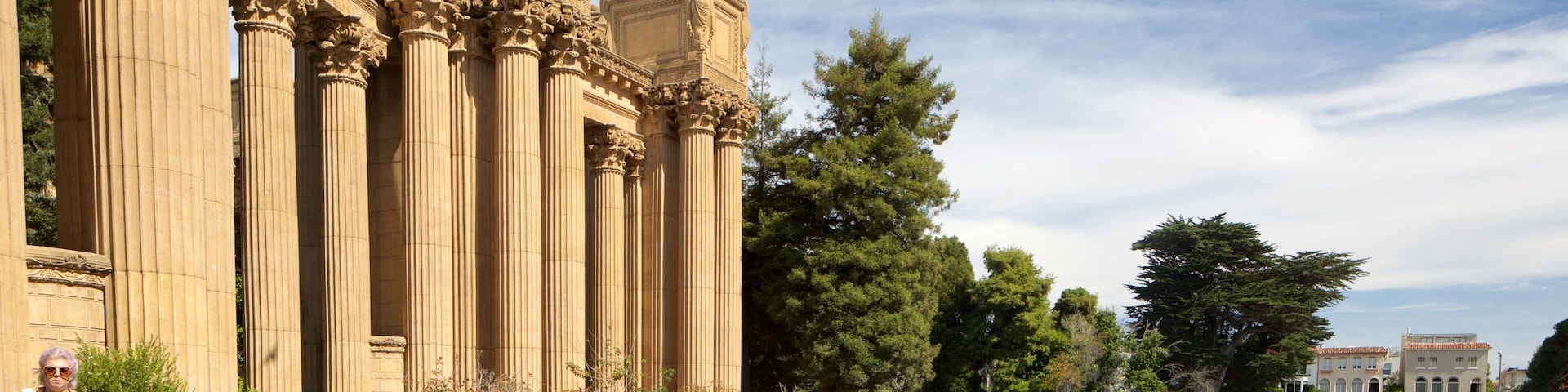 Marina District featuring a river or creek and heritage architecture as well as an individual femail