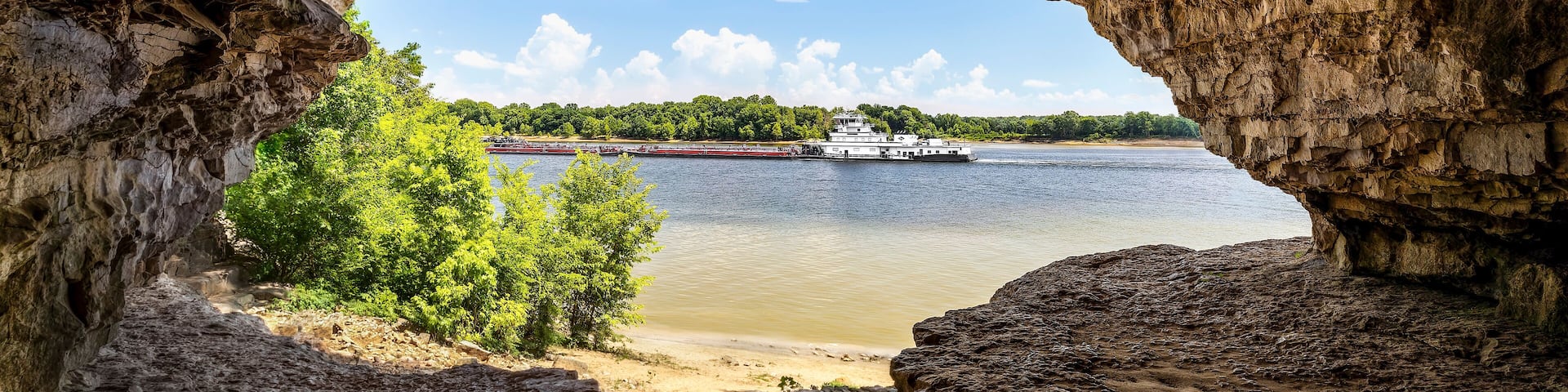 An Ohio River barge is viewed from Cave-In-Rock, a natural cavern and main attraction of its namesake Illinois state park. The cave, in a limestone bluff, is said to have been a pirates’ hideout.