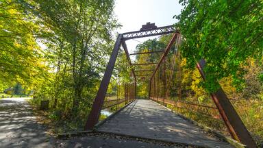 The Historic Bridge park in Battle Creek, Michigan utilizes historic bridges from the state of Michigan on its hiking trails. This includes a portion of the North Country Trail.