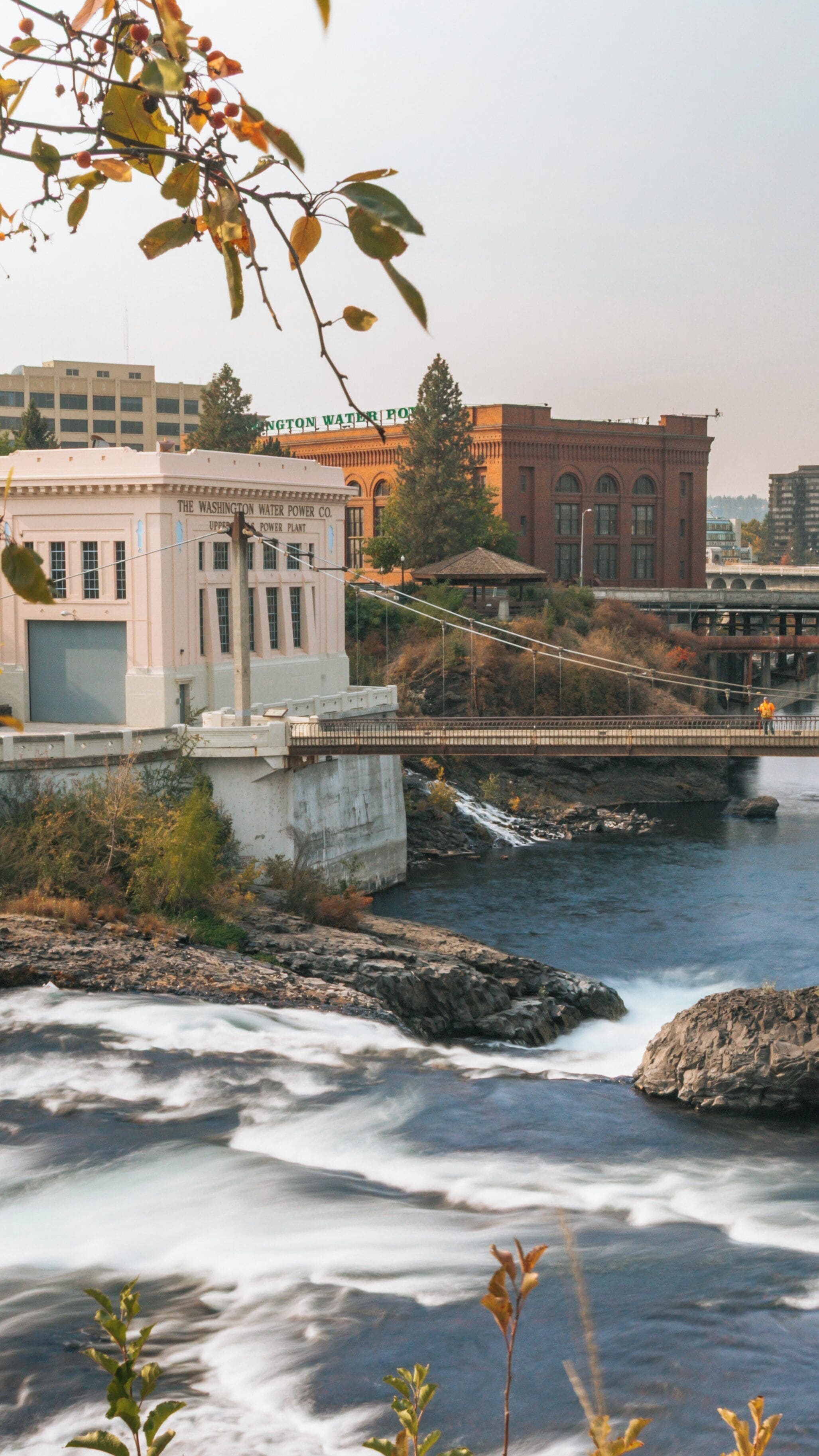 Glimpse of Riverfront Park with Historic Architecture and Serene Waters in Downtown Spokane