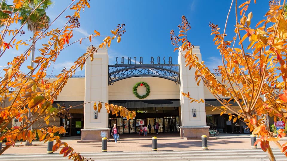 Santa Rosa's entrance with a wreath, autumn leaves, and a clear blue sky.