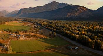 Aerial Panoramic View of the Historic Methow Valley in Eastern Washington State. Farm and ranch land lead to the North Cascade Mountains in this stunning landscape photographed on an autumnal morning.