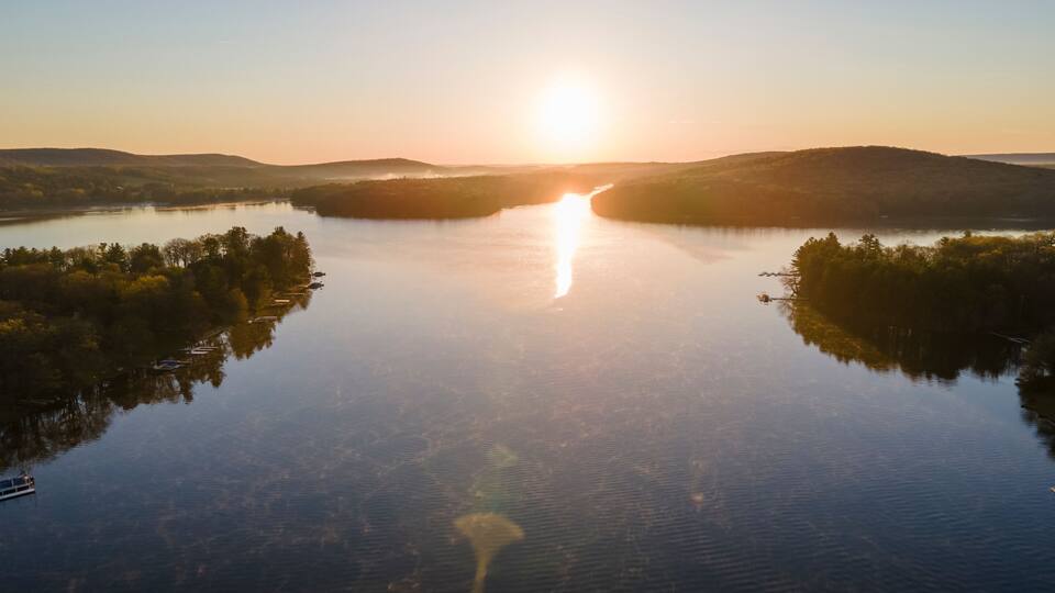 Aerial view of the sunrise over Deep Creek Lake in McHenry Maryland, United States.