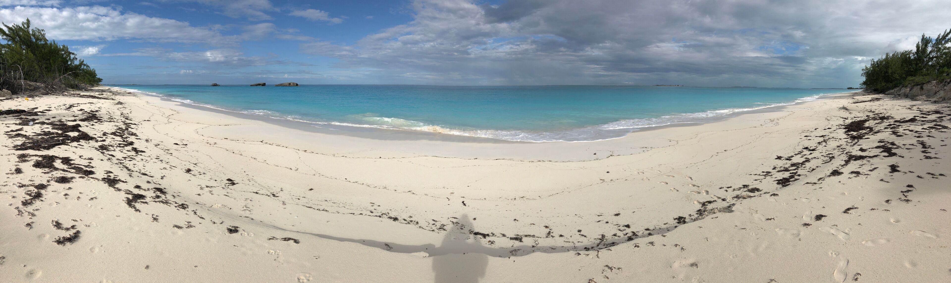 Panoramic view of a beautiful stretch of white sand beach in the Bahamas
