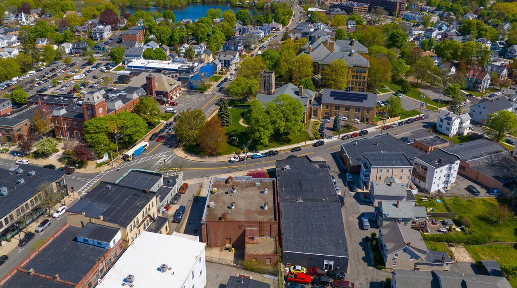 Historic commercial buildings aerial view on Main Street with Ell Pond at the back in historic city center of Melrose, Massachusetts MA, USA.