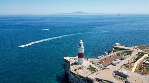 Aerial view of the lighthouse, boat, and the Africa continent in a background, Gibraltar