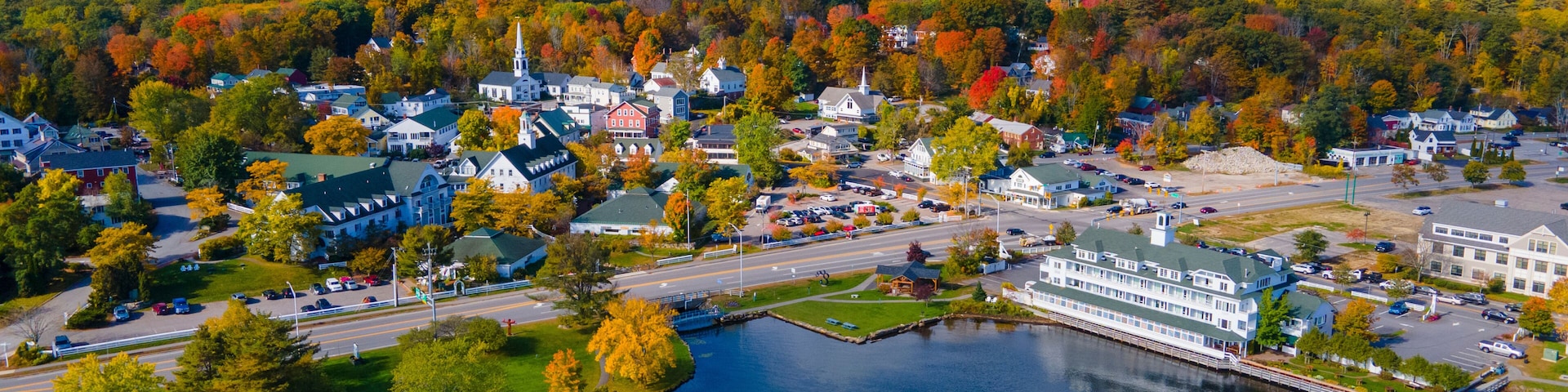 Meredith town center with fall foliage aerial view in fall with Meredith Bay in Lake Winnipesaukee, New Hampshire NH, USA.