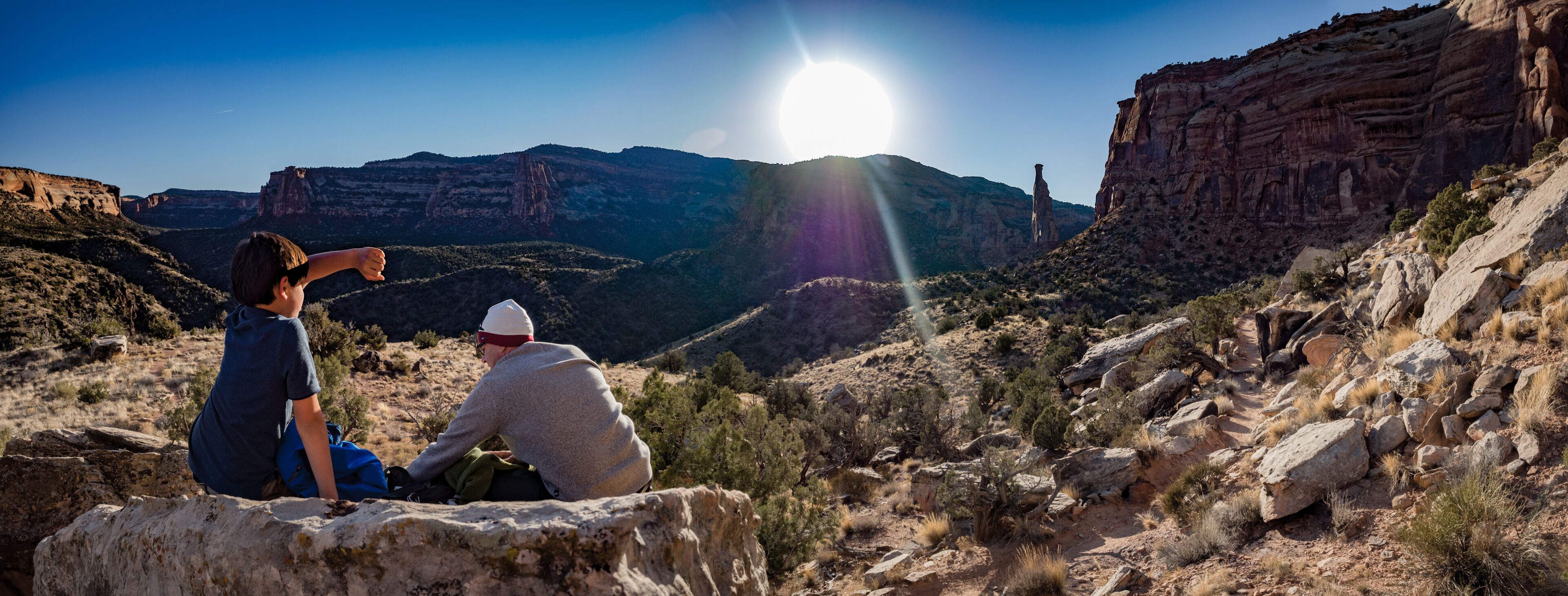 Father and son at sunset in the Colorado National Monument
