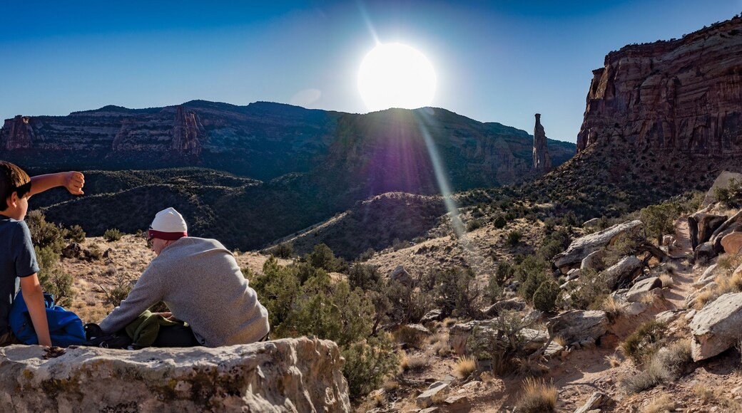 Father and son at sunset in the Colorado National Monument