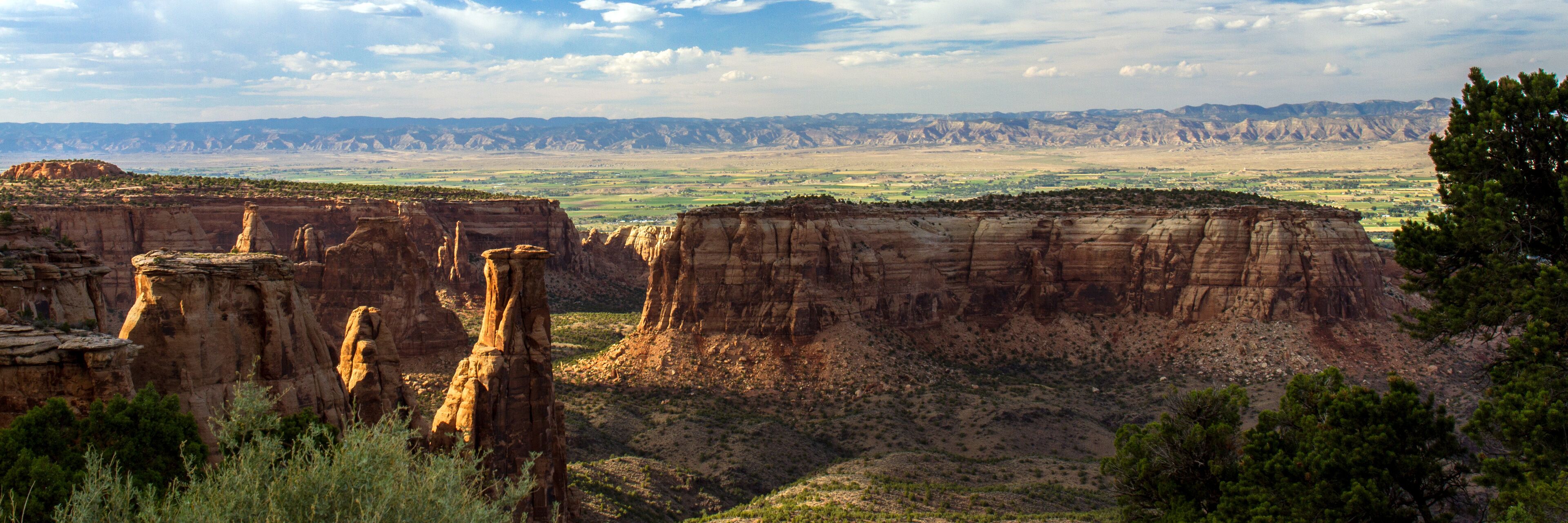 Colorado National Monument's backlit "Independence Monument" glows late in the evening, near the towns of Fruita and Grand Junction