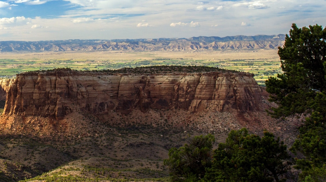 Colorado National Monument's backlit "Independence Monument" glows late in the evening, near the towns of Fruita and Grand Junction