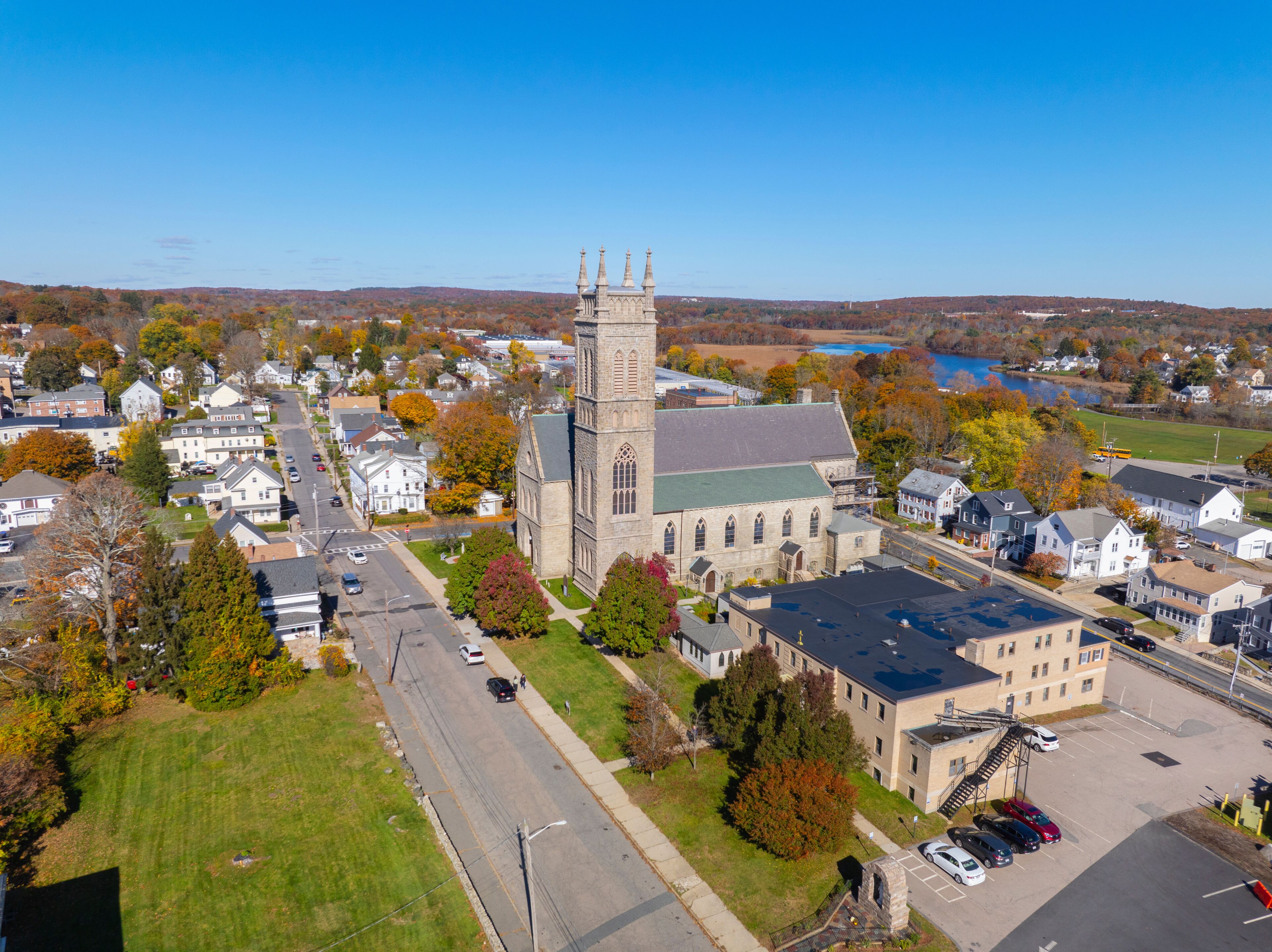 Saint Mary of the Assumption Church aerial view in fall at 17 Winter Street in historic town center of Milford, Massachusetts MA, USA. 