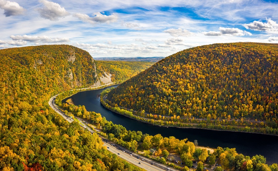 Aerial view of Delaware Water Gap on a sunny autumn day with forward camera motion. The Delaware Water Gap is a water gap on the border of the U.S. states of New Jersey and Pennsylvania