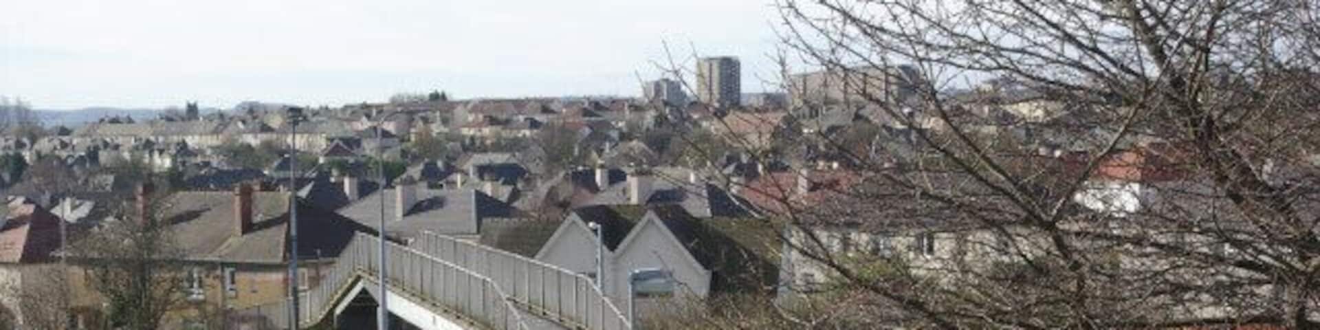 Forth and Clyde Canal, Westerton Showing the footbridge over the canal just south of Westerton station. Spread out beyond are the north Clyde suburbs.