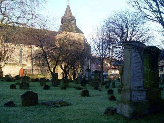 Gravestones in cemetery by Main Street, Rutherglen Behind a church that looks onto the town's King Street.