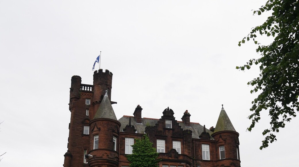 This castle is now a hotel in Glasgow. The grounds it sits on are lush, and within good walking distance from the train