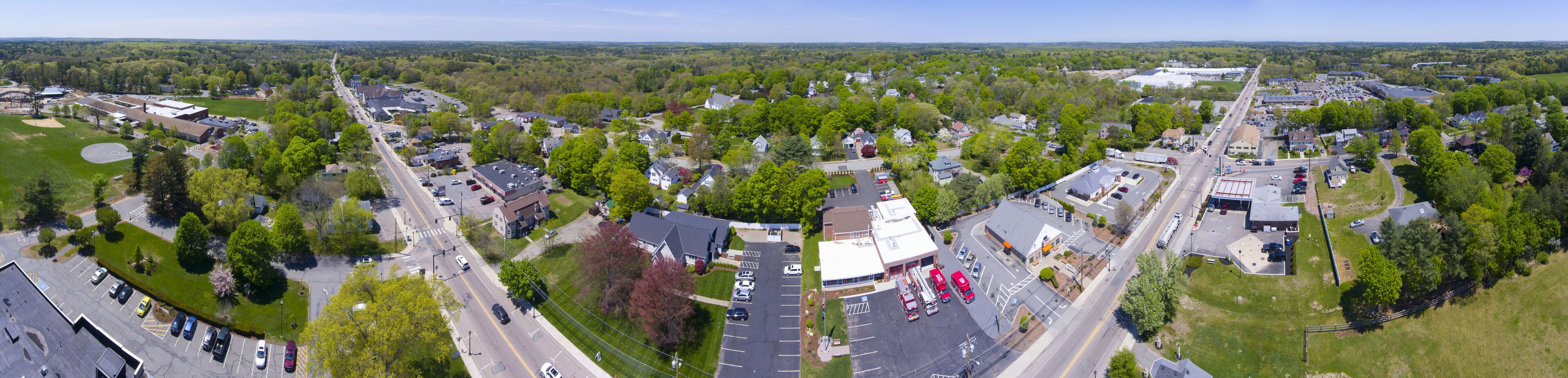 A suburban area with a fire station, residential houses, and a large industrial building.
