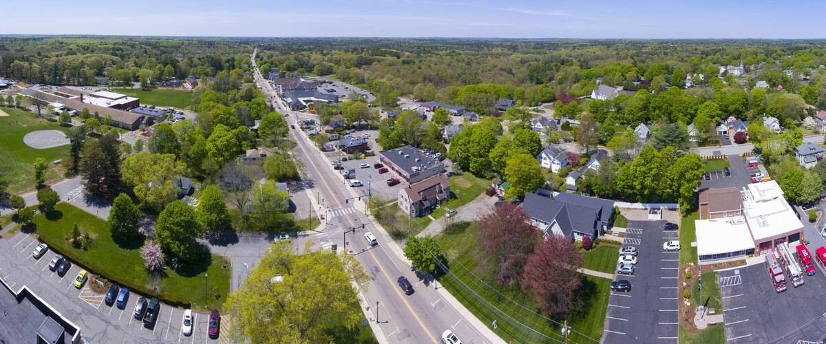 A suburban area with a fire station, residential houses, and a large industrial building.