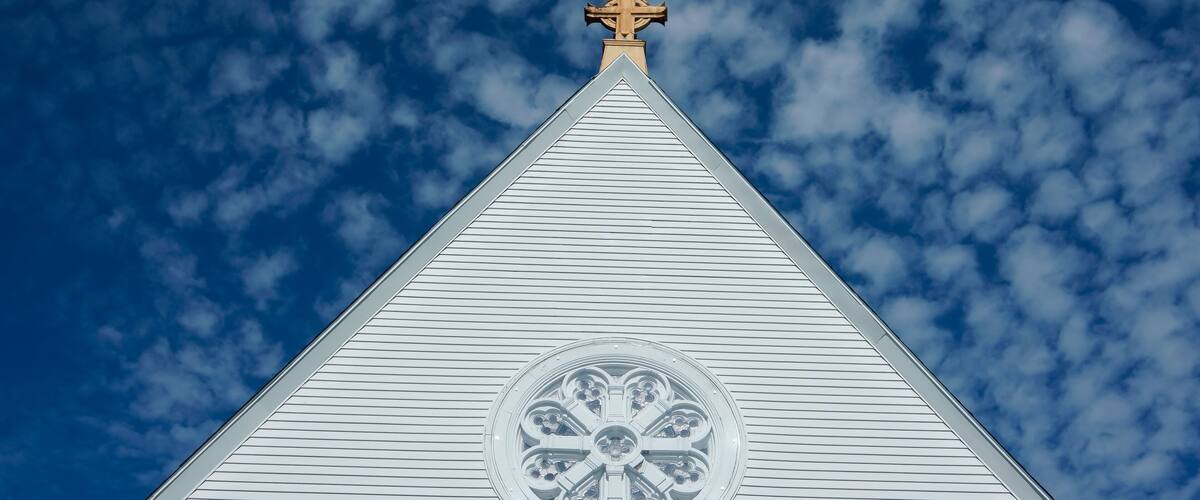 church steeple against blue sky