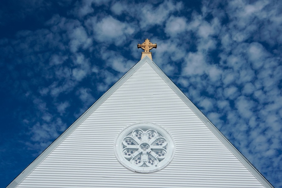 church steeple against blue sky
