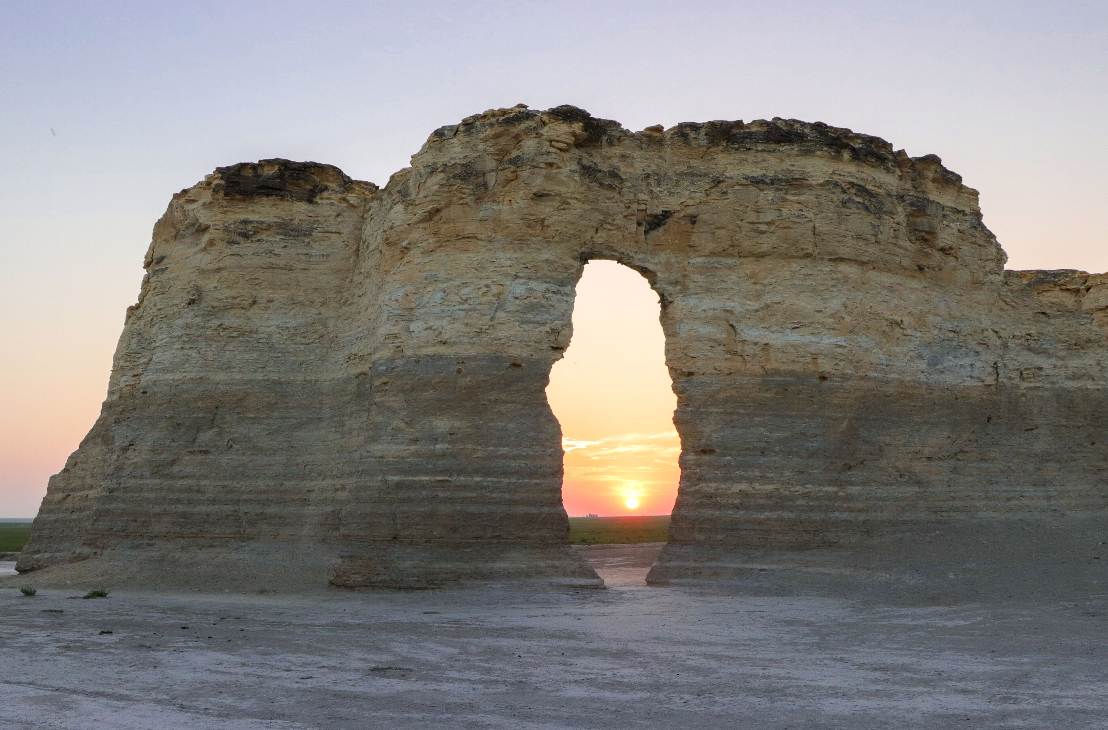 Monument Rocks Keyhole at sunset. Chalk pyramid geologic formation in western Kansas seen as sun sets on the Kansas High Plains.