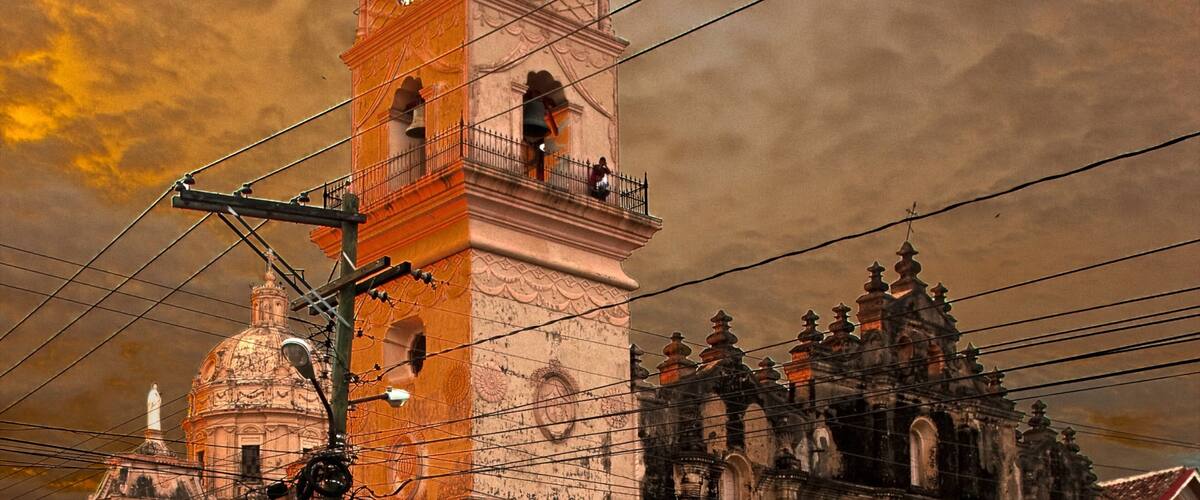 Nicaragua showing a sunset, religious elements and heritage architecture