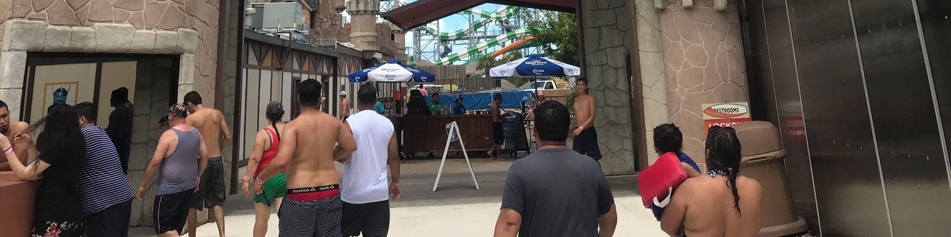 A castle-like entrance with a sign reading "SCHLITTERBAHN GALVESTON ISLAND".