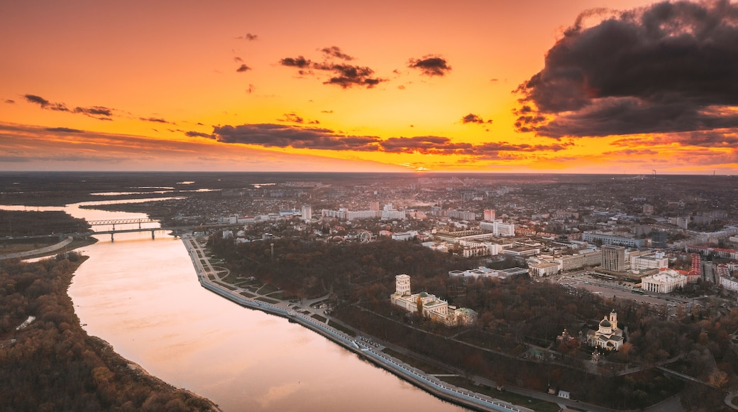 Gomel, Belarus. Aerial View Of City Park Paskeviches Palace And Homiel Cityscape Skyline In Autumn Evening. Residential District And River During Sunset. Bird's-eye View