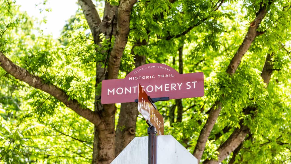 Montgomery, USA historic street road sign closeup during day in capital Alabama city in downtown old town historic text trail