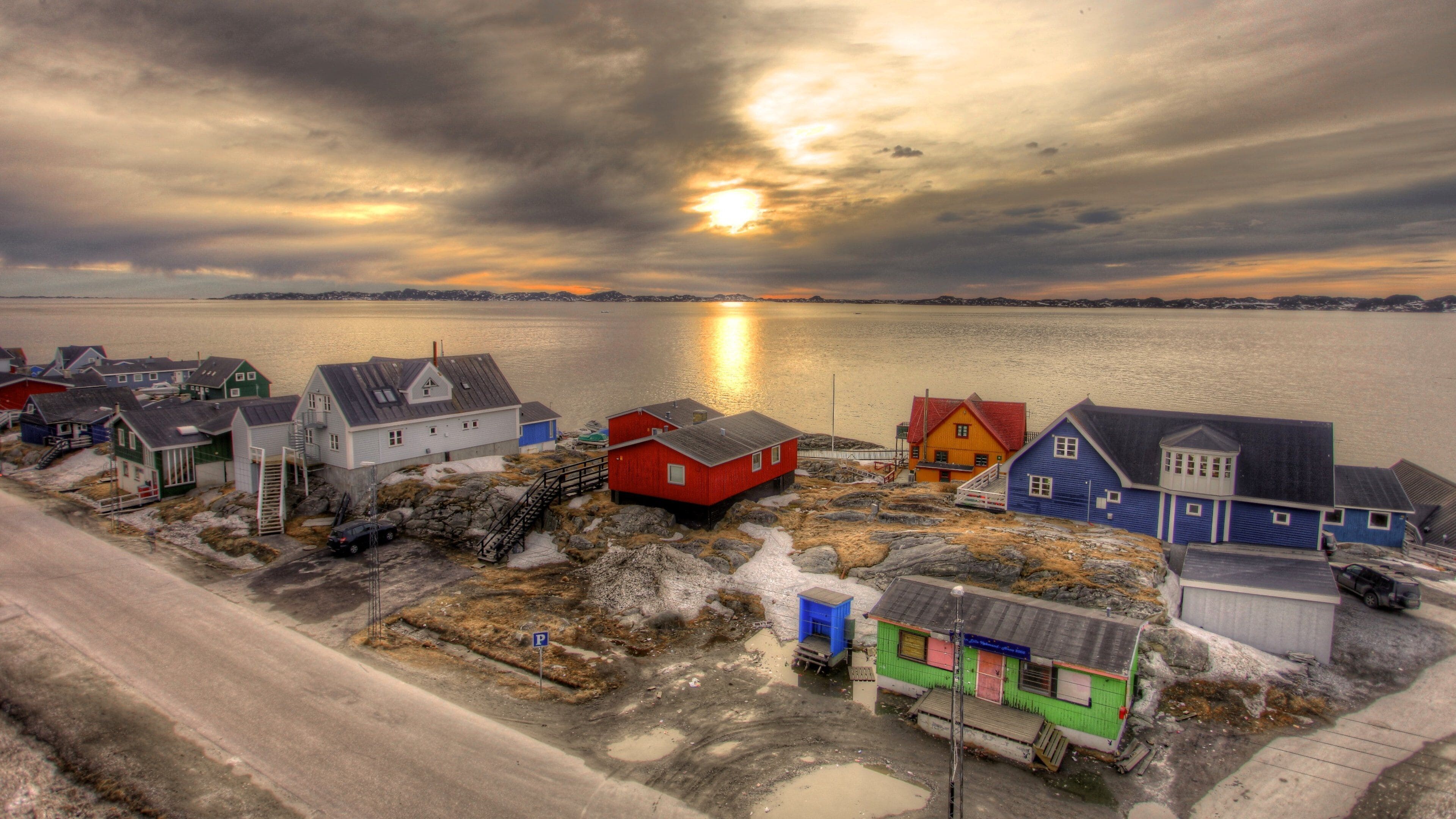 Nuuk showing a small town or village, a sunset and a lake or waterhole