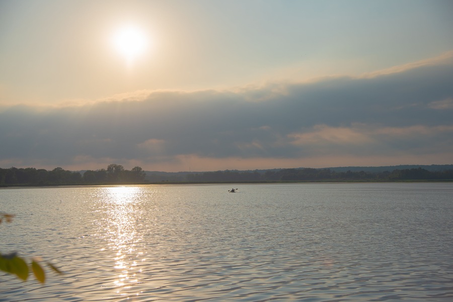 Man kayaking on Phantom Lake at Sunset. Phantom Lake, Mukwonago, Wisconsin, USA