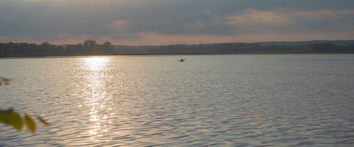 Man kayaking on Phantom Lake at Sunset. Phantom Lake, Mukwonago, Wisconsin, USA