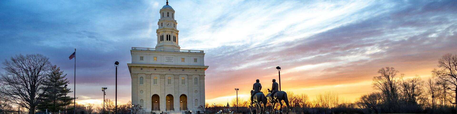 Nauvoo IL Temple at sunrise with bright red and yellow sky