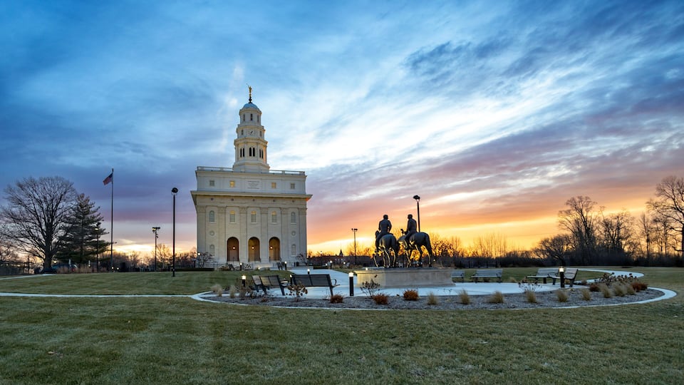 Nauvoo IL Temple at sunrise with bright red and yellow sky