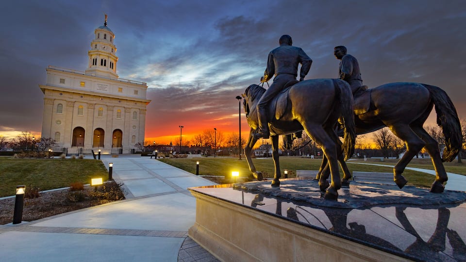 Nauvoo IL Temple at sunrise with bright red and yellow sky