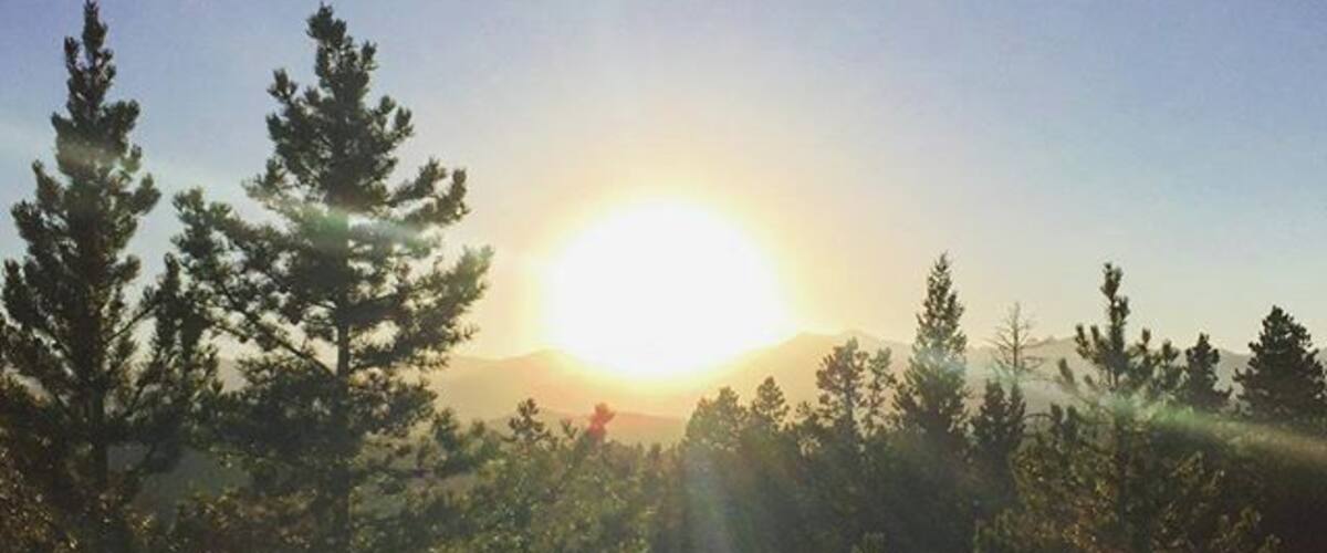 In case you were wondering what it looks like to stare at the #sun in the #mountains amidst the #forest #nederland #Colorado #WeekendGetaway