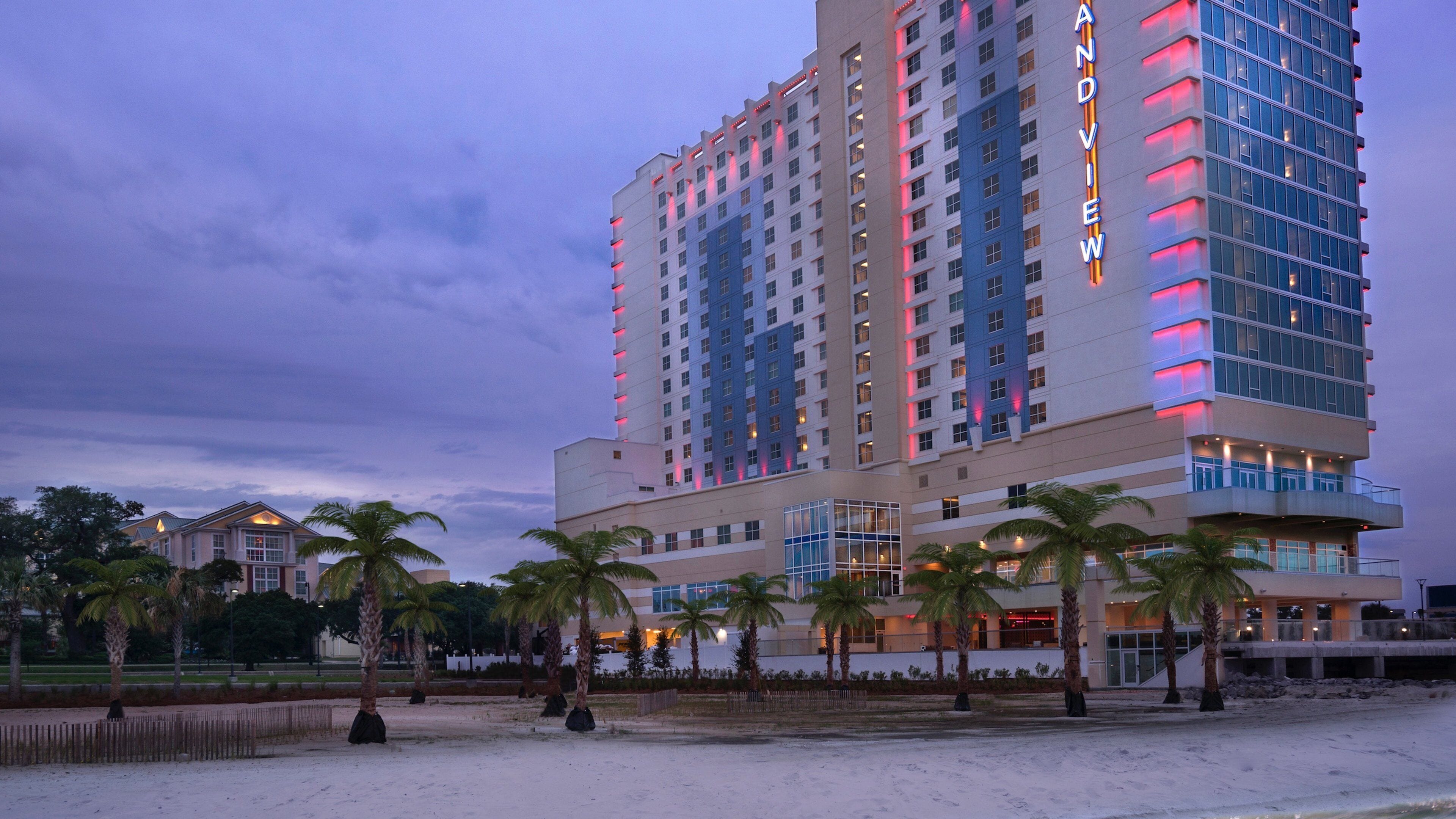 Gulfport featuring a beach, general coastal views and night scenes