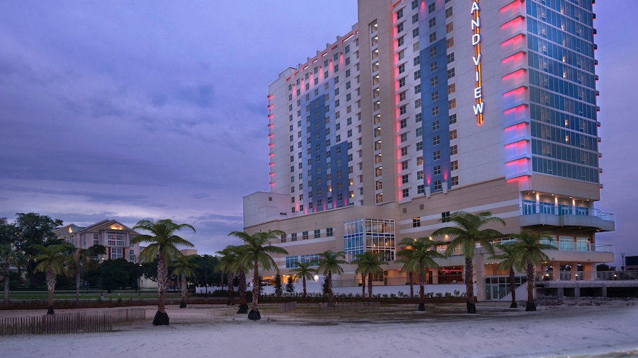 Gulfport featuring a beach, general coastal views and night scenes