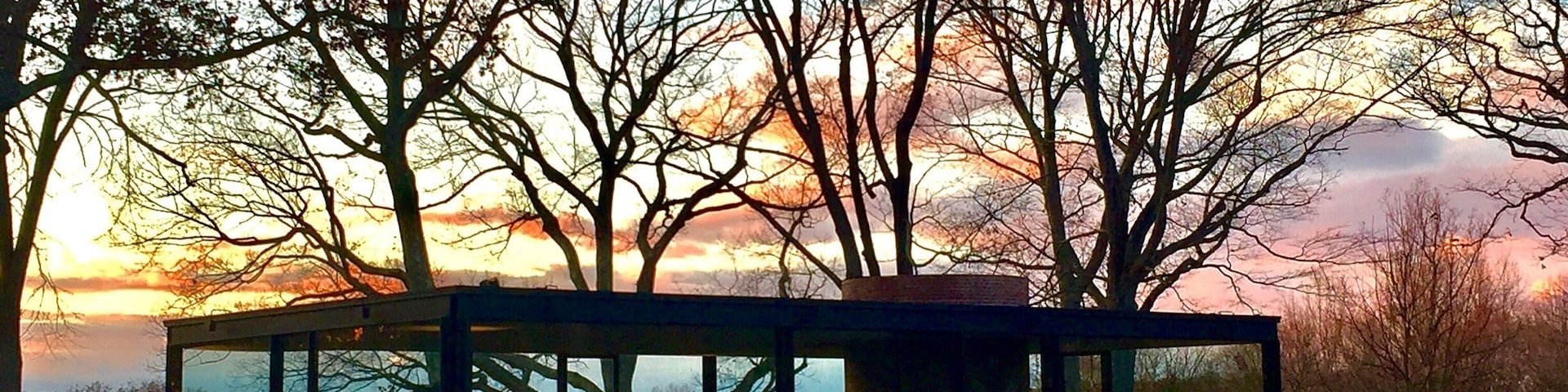 Glasshouse by Phillip Johnson, we went there in November and we were able to see it when the Sun is setting. Stunning!!