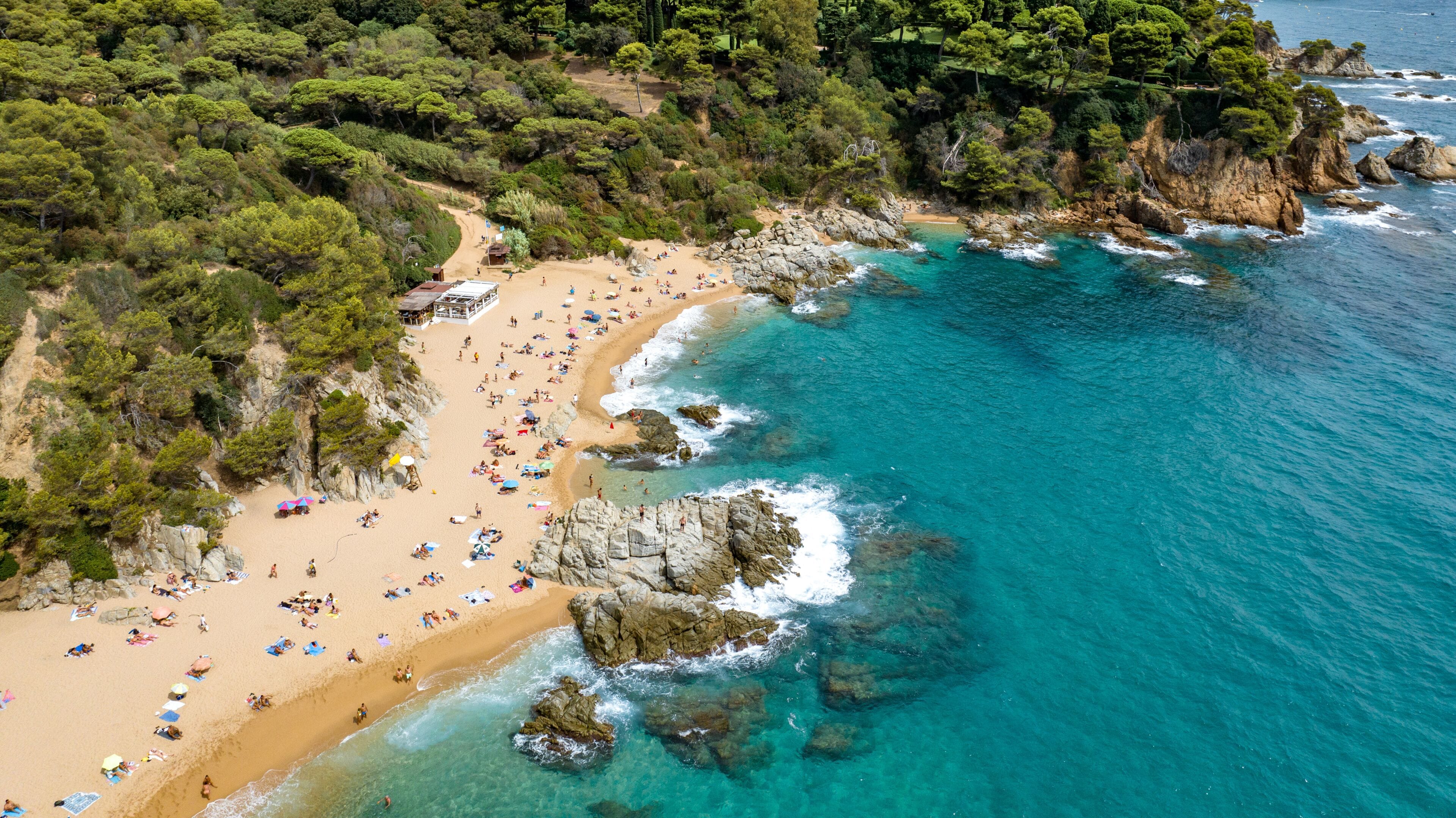 Resort town on the Mediterranean coast in Spain. Drone view of the beach in the town of Lloret De Mar. Cala Sa Boadella	