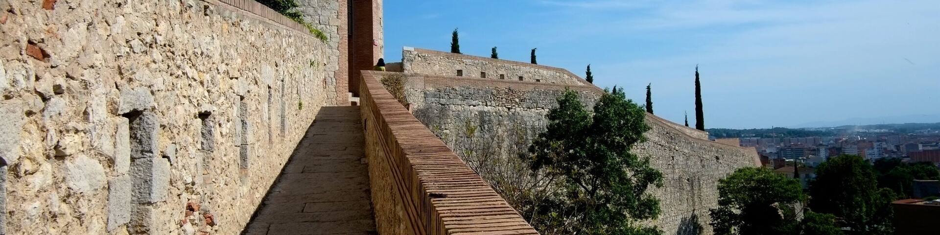 Girona’s imperious walls were first built by the Romans but were expanded in the time of Charlemagne in the early 800s and then enlarged again in the 14th century.
They are in a good state today following restoration work, and you can set off on a walk along the ramparts around nearly the whole of the old quarter.
There are regular watchtowers with stairways up to the best vantage points to see Girona’s skyline.
