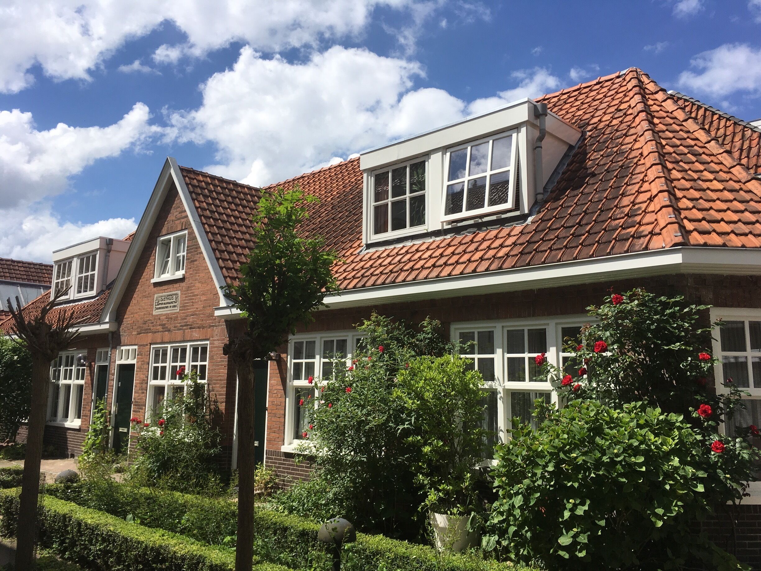 Take a peek through the gate right of the church and find these great tiny houses. Maybe once for the not so wealthy, now they easily compete with any urban villa. 

You can take a break on one of the benches, but don't park your bike here! 