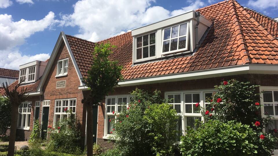 Take a peek through the gate right of the church and find these great tiny houses. Maybe once for the not so wealthy, now they easily compete with any urban villa.
You can take a break on one of the benches, but don't park your bike here!