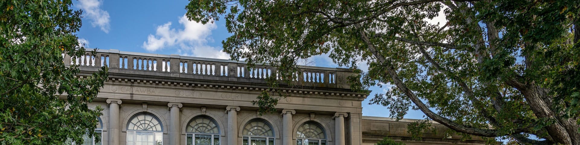 A historic building with arched windows and a sign reading "History Museum of Davidson County."