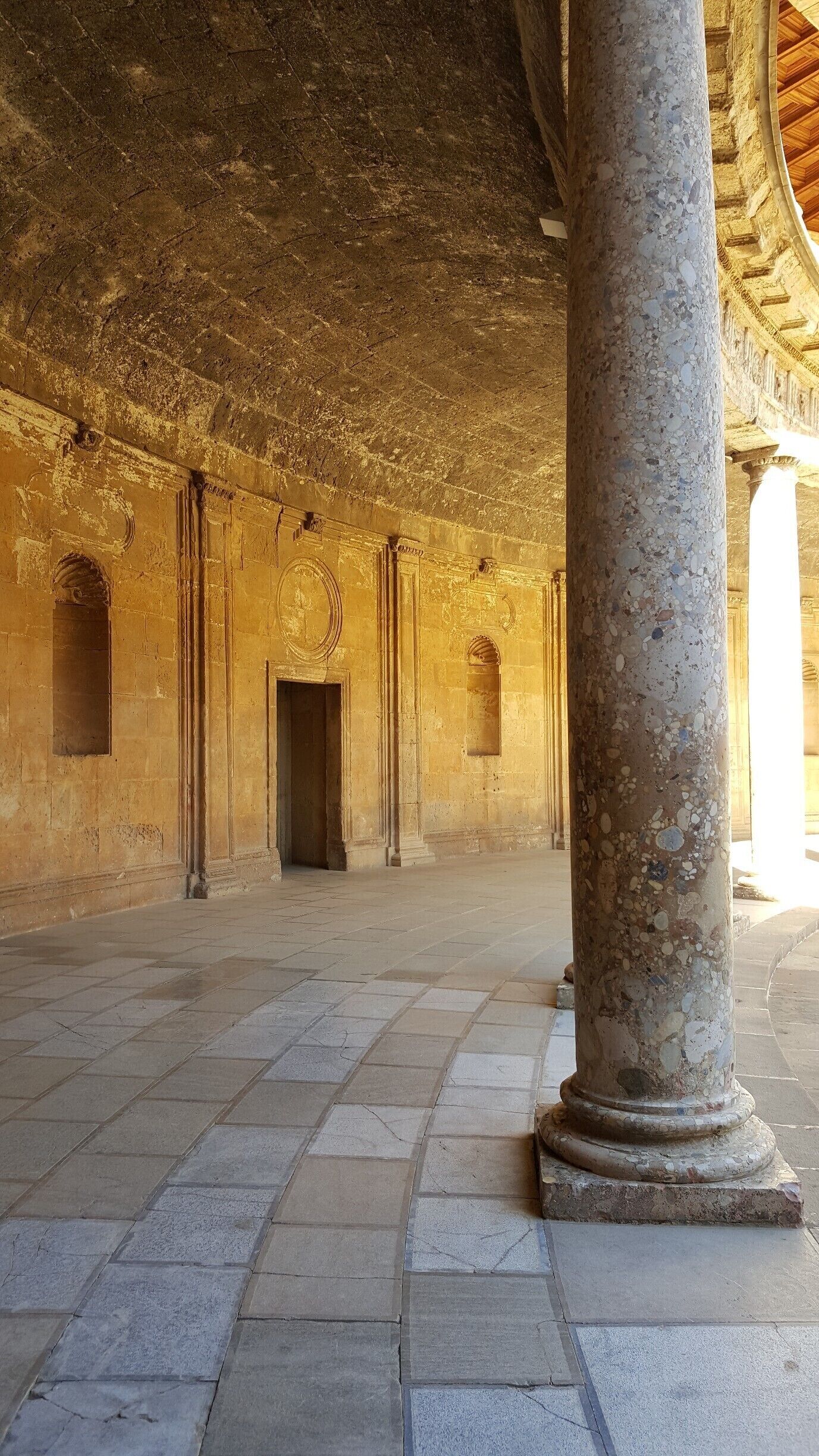 This open, circular, two leveled patio, is in the centre of the square palace.

-2017