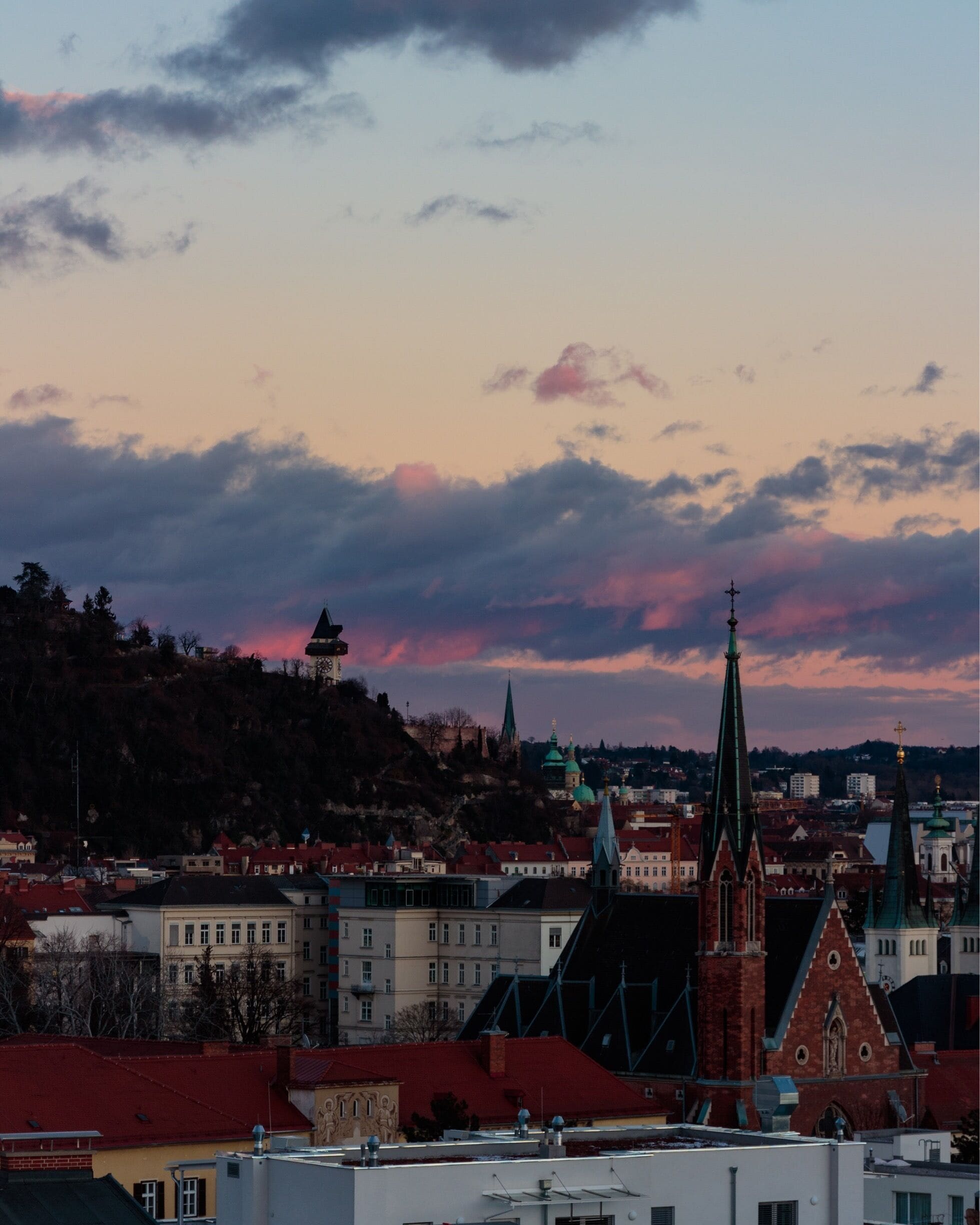 The Uhrturm/Clock tower of Graz at sunset 🌄