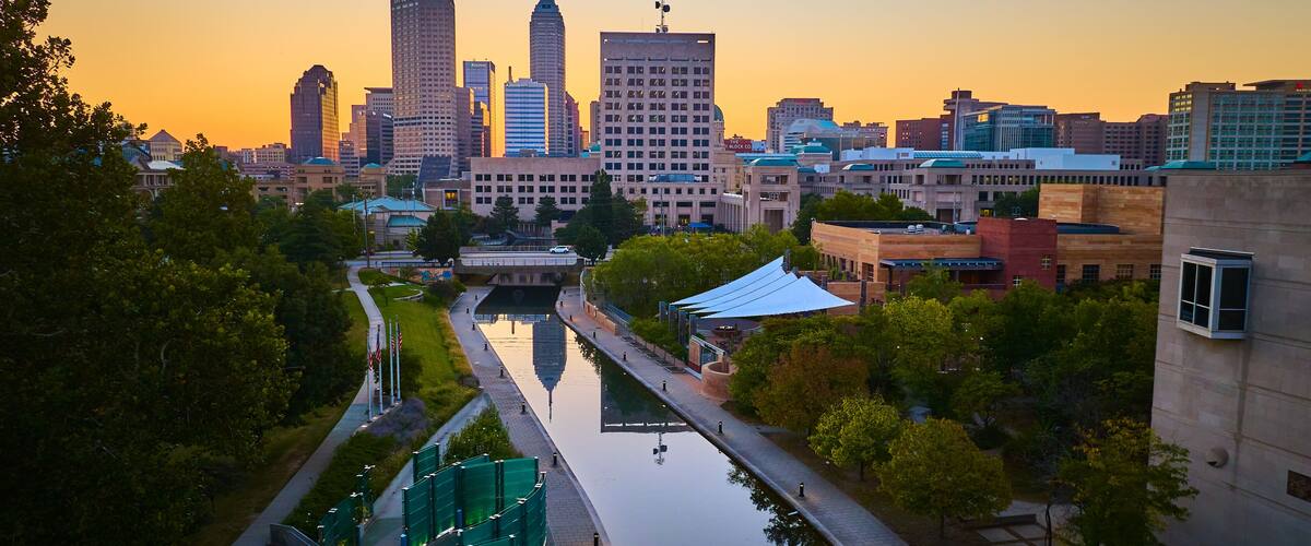 Aerial Sunset Glow on Indianapolis Skyline and Canal Reflections