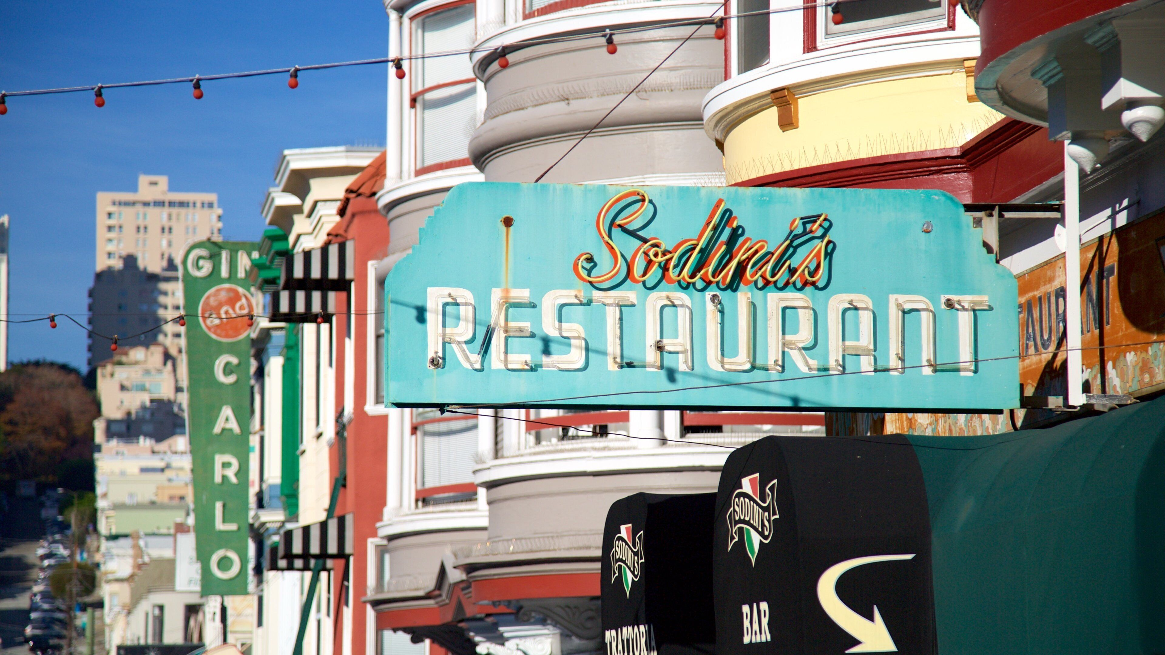 North Beach which includes a coastal town, signage and a city