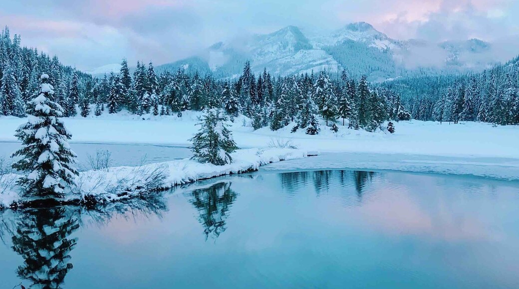 Beautiful Christmas winter sunset at Gold Creek Pond. In the wintertime you have to park on the side of the road, almost right off the highway and snowshoe (you might not need the snowshoes is the snow is packed enough) to the trailhead.